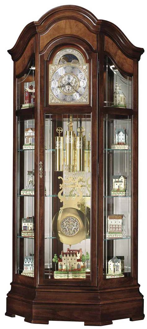 All glass, front and sides, is hand beveled. . Howard miller grandfather clock